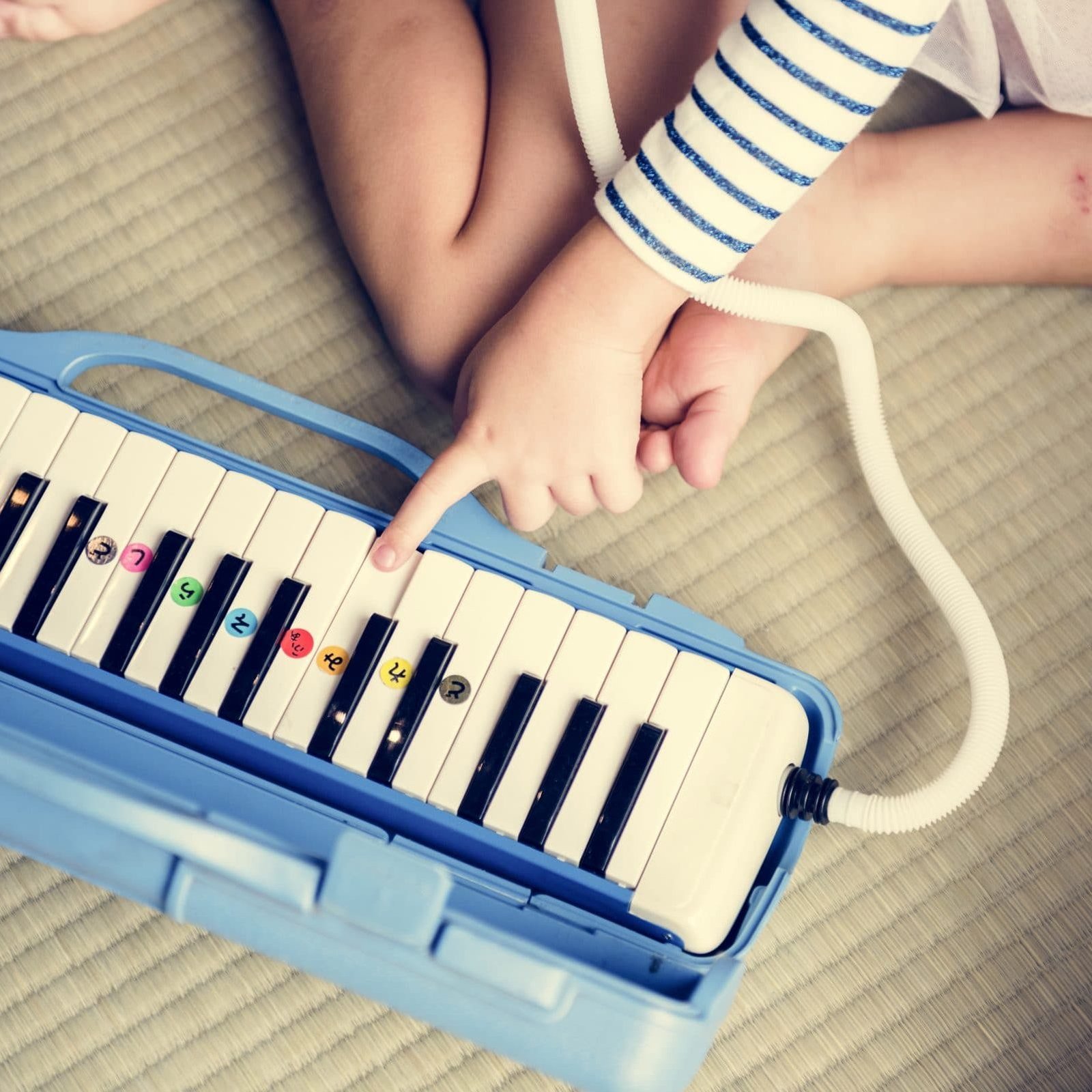 Girl palying piano music toy equipment Girl palying piano music toy equipment